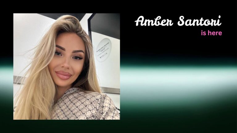 A high-resolution photo of creator Amber Santori set against a sleek gray and silver background with the text 'Amber Santori is Here,' showcasing her 85% first-month payout and 1.2s AI voice-cloning features on Fanvue in 2026.